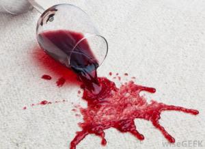 glass-of-red-wine-spilled-on-a-white-carpet